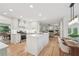 Bright white kitchen features stainless steel appliances, an island, and an open layout at 3988 Dover Ave, Alpharetta, GA 30009