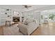 Cozy living room with a stone fireplace, built-in bookshelves, and access to outdoor living space at 3988 Dover Ave, Alpharetta, GA 30009