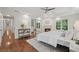 Spacious main bedroom featuring fireplace, seating area, hardwood floors, and plenty of natural light at 3988 Dover Ave, Alpharetta, GA 30009