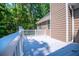 A lovely back deck with white railings is a great addition to any home at 4149 Yancey Rd, Douglasville, GA 30135