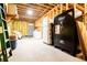Unfinished basement area provides additional storage and a door to the backyard at 4149 Yancey Rd, Douglasville, GA 30135