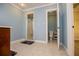 Bathroom with tile floors, a vanity, shower, and toilet next to a closet at 4149 Yancey Rd, Douglasville, GA 30135