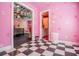 Quirky bedroom view of a pink room with painted hand prints, leading into zebra-themed area at 4149 Yancey Rd, Douglasville, GA 30135