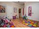 Playroom with hardwood floors, natural light, and a variety of toys and play areas for children at 4149 Yancey Rd, Douglasville, GA 30135