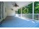 Relax under this spacious, covered deck with dual ceiling fans, overlooking a lush wooded backyard at 4149 Yancey Rd, Douglasville, GA 30135