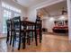 Cozy dining area with seating for four, leading to an adjacent living room at 4149 Yancey Rd, Douglasville, GA 30135