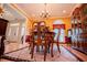 Dining room with wood table, chandelier, and elegant decor at 4149 Yancey Rd, Douglasville, GA 30135