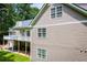 Exterior side-angle view of this two-story home with a multi-level deck at 4149 Yancey Rd, Douglasville, GA 30135