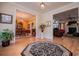 Spacious foyer with hardwood floors, a decorative rug, and a view of the living and dining areas at 4149 Yancey Rd, Douglasville, GA 30135