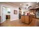 Open kitchen area with a central island, stainless appliances, and wood cabinetry at 4149 Yancey Rd, Douglasville, GA 30135