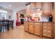 Well-equipped kitchen with wood cabinets, breakfast nook, and modern lighting at 4149 Yancey Rd, Douglasville, GA 30135