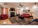 Inviting living room features fireplace, hardwood floors, and large rug at 4149 Yancey Rd, Douglasville, GA 30135