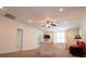 Open-concept living room offers neutral walls, plush carpet, and bright natural lighting at 4149 Yancey Rd, Douglasville, GA 30135