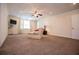 Spacious living room with neutral walls, plush carpeting, and recessed lighting provides comfort at 4149 Yancey Rd, Douglasville, GA 30135