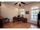 Home office featuring wood floors, a ceiling fan, and a large window for natural light, creating a productive workspace at 4149 Yancey Rd, Douglasville, GA 30135
