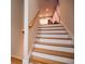 A wood-trimmed staircase ascends to a whimsically decorated upper level at 4149 Yancey Rd, Douglasville, GA 30135
