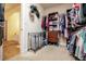 Spacious walk-in closet featuring ample storage racks and carpet at 4149 Yancey Rd, Douglasville, GA 30135