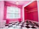 Bright pink walk-in closet with zebra print rug and painted handprints at 4149 Yancey Rd, Douglasville, GA 30135