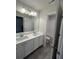 Bright bathroom featuring double vanity, white countertops, and modern fixtures at 4517 Ajo Walk, Atlanta, GA 30331