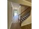 Inviting entryway with beautiful wood flooring and staircase leading to the upper level at 4517 Ajo Walk, Atlanta, GA 30331