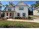 Charming two-story home featuring white siding, gray shutters and a beautifully landscaped front yard at 4517 Ajo Walk, Atlanta, GA 30331
