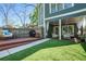 Inviting backyard features a patio with hanging swings, a lounge area, and a verdant artificial lawn at 1100 Wylie Se St # A, Atlanta, GA 30316
