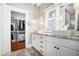 Well-lit bathroom with double sinks, modern cabinetry, and a walk-in closet with convenient storage at 1100 Wylie Se St # A, Atlanta, GA 30316