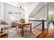 Bright dining room featuring a wood table, stylish chairs, and modern light fixture with wood flooring at 1100 Wylie Se St # A, Atlanta, GA 30316