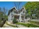 Charming two-story home with a inviting front porch and well-manicured lawn on a bright sunny day at 1100 Wylie Se St # A, Atlanta, GA 30316