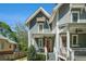 Beautiful gray two-story home showcasing charming front porches, orange front door and well-maintained landscaping at 1100 Wylie Se St # A, Atlanta, GA 30316