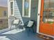 Inviting front porch with seating, painted siding, and a brightly painted front door at 1100 Wylie Se St # A, Atlanta, GA 30316