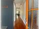 Hallway with hardwood floors, a dark accent wall, and a view through the home at 1100 Wylie Se St # A, Atlanta, GA 30316