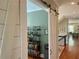 Open hallway with hardwood floors, modern light fixture and access to other rooms at 1100 Wylie Se St # A, Atlanta, GA 30316