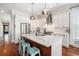 Eat-in kitchen featuring a large island with seating, stainless steel appliances, and modern lighting at 1100 Wylie Se St # A, Atlanta, GA 30316
