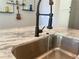 Close-up of a kitchen sink featuring granite countertops and a modern faucet at 1100 Wylie Se St # A, Atlanta, GA 30316