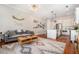 Spacious living space with kitchen, hardwood floors, modern light fixtures, and a comfortable sofa at 1100 Wylie Se St # A, Atlanta, GA 30316