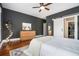 Cozy main bedroom features a large dresser, stylish lighting, and ensuite access via barn door at 1100 Wylie Se St # A, Atlanta, GA 30316