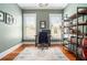 Home office featuring a desk, chair, bookshelf, hardwood floors and natural light from windows at 1100 Wylie Se St # A, Atlanta, GA 30316