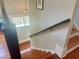 Wooden staircase with contrasting black railing and white risers at 1100 Wylie Se St # A, Atlanta, GA 30316