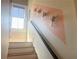 Bright staircase with a modern accent wall and natural light from a window with privacy blinds at 1100 Wylie Se St # A, Atlanta, GA 30316