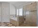Bathroom featuring a glass shower, bathtub, and window at 4279 Two Bridge Dr, Buford, GA 30518