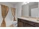 Bathroom featuring granite vanity top and shower with decorative curtain at 4279 Two Bridge Dr, Buford, GA 30518