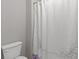 View of a bathroom featuring a white shower curtain and white toilet at 4279 Two Bridge Dr, Buford, GA 30518