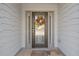 Stylish front door with decorative glass and sidelights, framed by elegant exterior siding at 4279 Two Bridge Dr, Buford, GA 30518