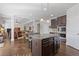Open concept kitchen with island, breakfast bar, and modern appliances at 4279 Two Bridge Dr, Buford, GA 30518