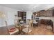 Kitchen features an island, stainless steel appliances, and dark cabinetry at 4279 Two Bridge Dr, Buford, GA 30518