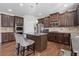 Spacious kitchen featuring stainless steel appliances, dark cabinets, and a kitchen island at 4279 Two Bridge Dr, Buford, GA 30518
