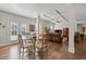 Open concept living with lots of windows, hardwood floors, and coffered ceilings at 4279 Two Bridge Dr, Buford, GA 30518