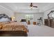 Spacious main bedroom with tray ceilings, ceiling fan, neutral walls, and plush carpet at 4279 Two Bridge Dr, Buford, GA 30518