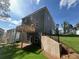 Backyard featuring a deck, black metal fencing, and a green lawn at 4520 Ajo Walk, Atlanta, GA 30331